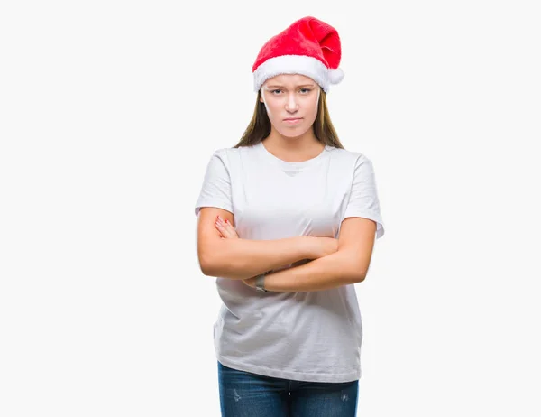 若い美しい白人女性の孤立した背景の懐疑論者と組んだ腕で顔の神経 不賛成式クリスマス帽子をかぶっています 否定的な人 — ストック写真