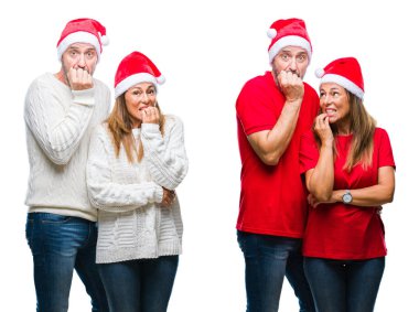 Kolaj stresli ve gergin ile beyaz izole arka plan üzerinde Noel şapka orta yaş olgun güzel çift tırnak ısırma dudaklarından eller. Anksiyete sorunu.