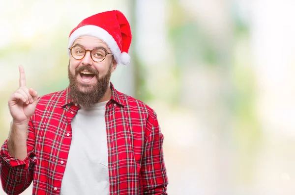 Young Caucasian Man Wearing Christmas Hat Isolated Background Pointing Finger — Stock Photo, Image