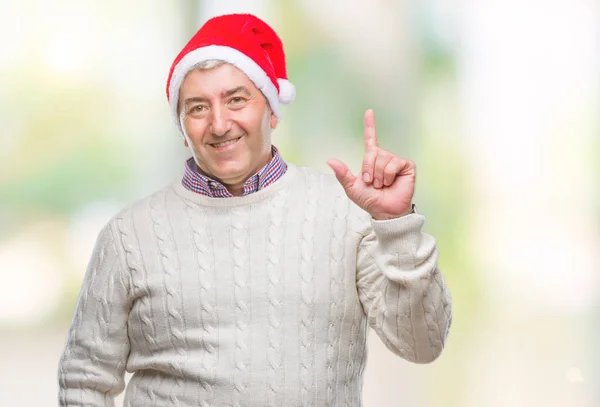 Hombre Mayor Guapo Con Sombrero Navidad Sobre Fondo Aislado Apuntando — Foto de Stock