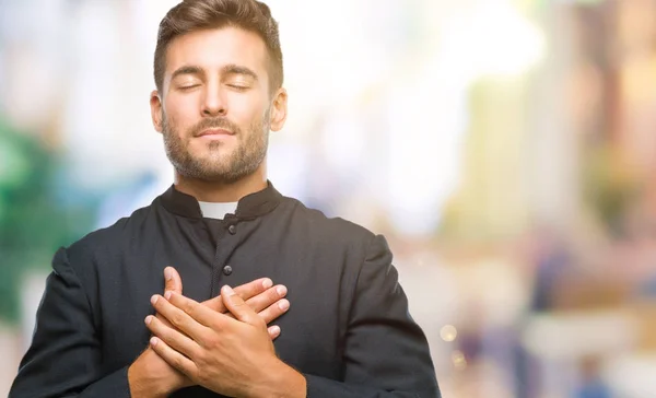 Jovem Padre Católico Cristão Sobre Fundo Isolado Sorrindo Com Mãos — Fotografia de Stock