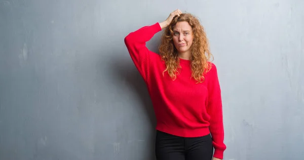 Young Redhead Woman Grey Grunge Wall Wearing Red Sweater Confuse — Stock Photo, Image