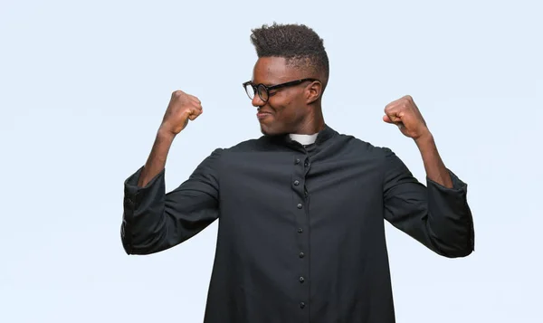 Young African American Priest Man Isolated Background Showing Arms Muscles — Stock Photo, Image