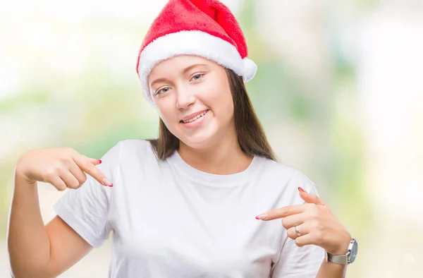 얼굴에 미소와 자신감 자부심과 손가락으로 자신을 가리키는 크리스마스 모자를 — 스톡 사진