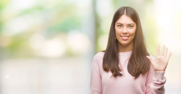 Junge Schöne Hispanische Frau Trägt Einen Pullover Und Zeigt Mit — Stockfoto