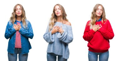 Beyaz izole arka plan ile gülümseyen genç güzel genç kadın kapalı gözler ve yüzünde minnettar jest ile göğüs üzerinde eller. Sağlık kavramı.