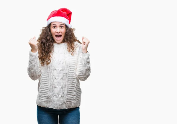 Junge Brünette Mädchen Mit Weihnachtsmütze Über Isoliertem Hintergrund Feiert Überrascht — Stockfoto