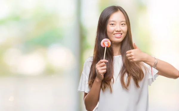 Young Asian Woman Eating Lollipop Candy Isolated Background Happy Big — Stock Photo, Image