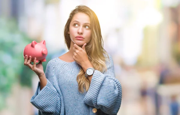 Young Beautiful Blonde Woman Holding Piggy Bank Isolated Background Serious — Stock Photo, Image