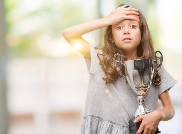 Brunette Hispanic Girl Holding Trophy Stressed Hand Head Shocked Shame — Stock Photo, Image