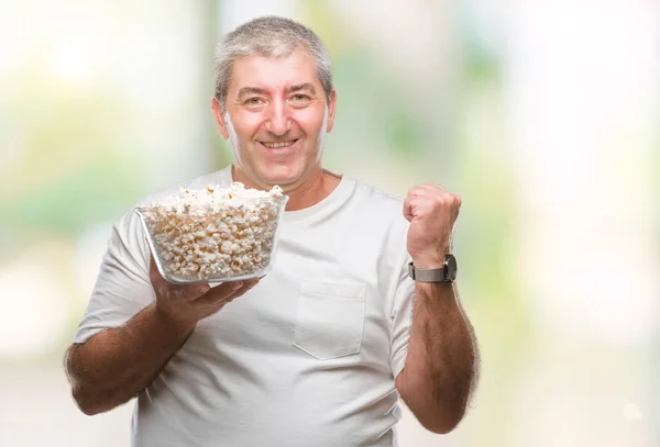 Handsome Senior Man Eating Popcorn Isolated Background Screaming Proud Celebrating — Stock Photo, Image