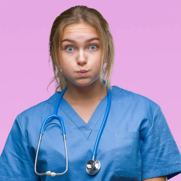 Young Caucasian Doctor Woman Wearing Surgeon Uniform Isolated Background Puffing — Stock Photo, Image