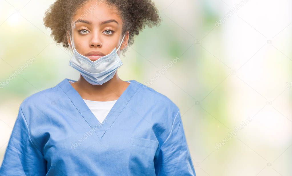 Young afro american doctor woman over isolated background with serious expression on face. Simple and natural looking at the camera.