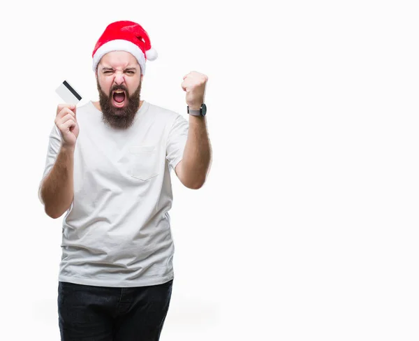 Joven Hombre Caucásico Con Sombrero Navidad Sosteniendo Tarjeta Crédito Sobre — Foto de Stock