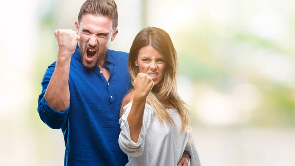 Young Couple Love Isolated Background Angry Mad Raising Fist Frustrated — Stock Photo, Image
