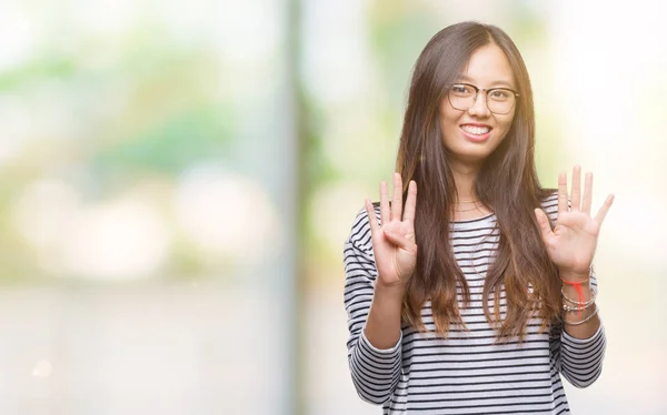 Young Asian Woman Wearing Glasses Isolated Background Showing Pointing Fingers — Stock Photo, Image