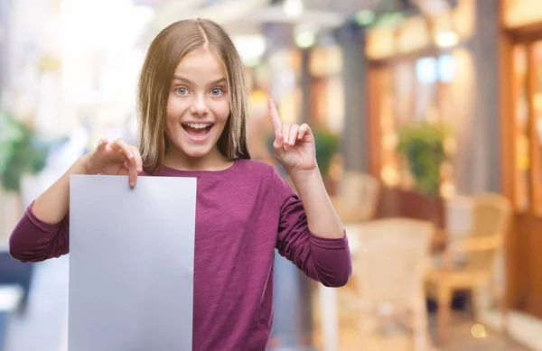 Young Beautiful Girl Holding Blank Sheet Paper Isolated Background Surprised — Stock Photo, Image