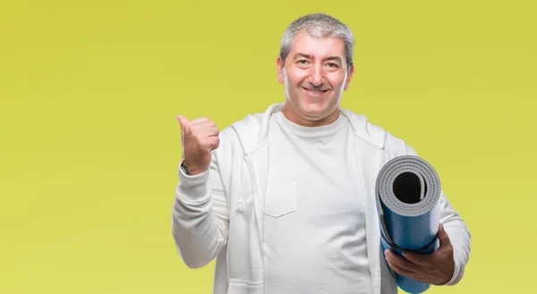 Handsome Senior Man Holding Yoga Mat Isolated Background Pointing Showing — Stock Photo, Image