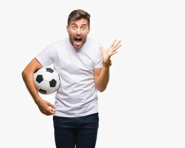 Jovem Homem Bonito Segurando Bola Futebol Sobre Fundo Isolado Muito — Fotografia de Stock