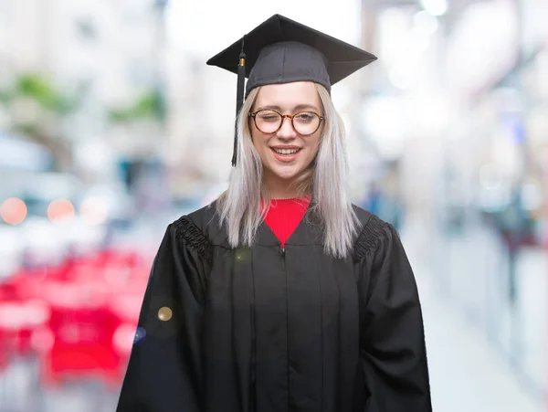 Mujer Rubia Joven Con Uniforme Graduado Sobre Fondo Aislado Guiño —  Fotos de Stock