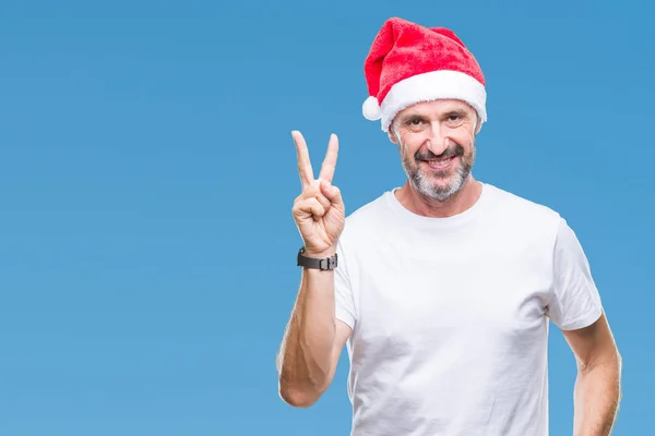 Hombre Mediana Edad Con Sombrero Navidad Sobre Fondo Aislado Sonriendo — Foto de Stock