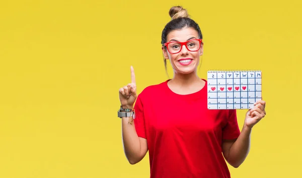 Mooie Jongedame Bedrijf Menstruatie Kalender Geïsoleerde Achtergrond Verrast Met Een — Stockfoto