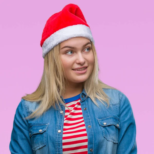 Mujer Caucásica Joven Con Sombrero Navidad Sobre Fondo Aislado Mirando —  Fotos de Stock