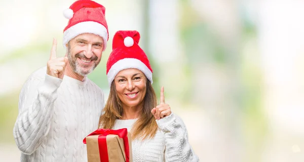 스페인 크리스마스 모자를 선물을 아이디어 가리키는 손가락 — 스톡 사진