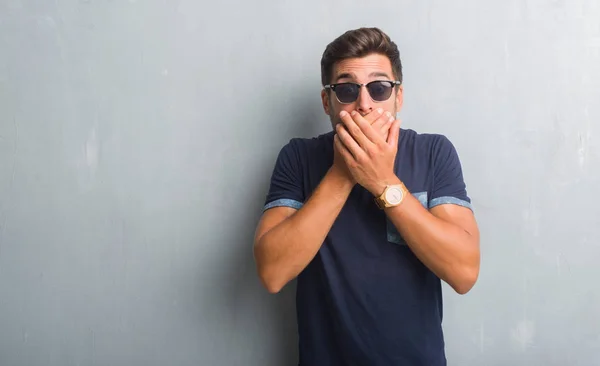 Handsome Young Man Grey Grunge Wall Wearing Sunglasses Shocked Covering — Stock Photo, Image