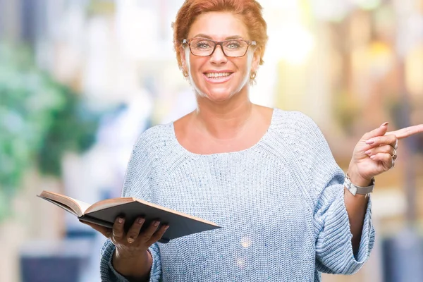 Senior Caucasian Woman Reading Book Isolated Background Very Happy Pointing — Stock Photo, Image