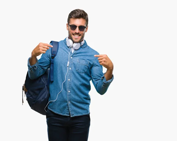 Young Handsome Tourist Man Wearing Headphones Backpack Isolated Background Looking — Stock Photo, Image