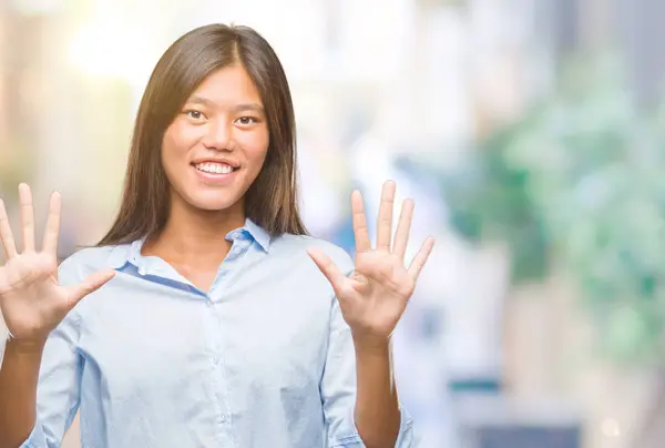 Young Asian Business Woman Isolated Background Showing Pointing Fingers Number — Stock Photo, Image