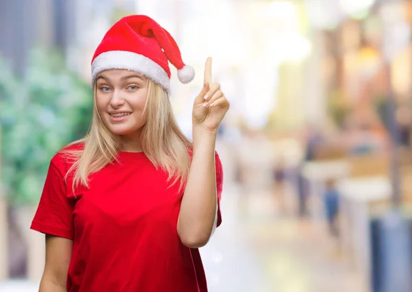 Jonge Kaukasische Vrouw Kerstmuts Dragen Geïsoleerd Achtergrond Vinger Omhoog Met — Stockfoto