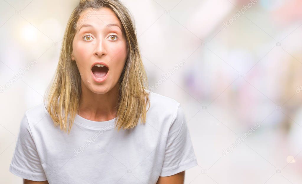 Young beautiful woman over isolated background afraid and shocked with surprise expression, fear and excited face.