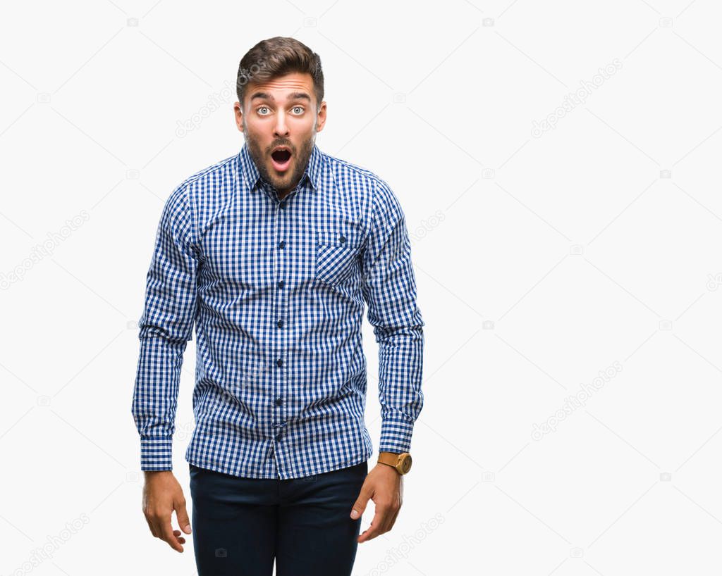 Young handsome man over isolated background afraid and shocked with surprise expression, fear and excited face.