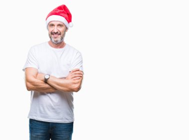 Üzerinde Noel şapka orta yaş ağarmış komuta sizde mutlu yüz ile gülümseyerek kameraya seyir silah geçti arka plan izole. Olumlu bir kişi.