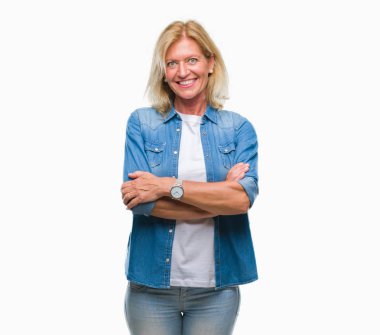 Middle age blonde woman over isolated background happy face smiling with crossed arms looking at the camera. Positive person.