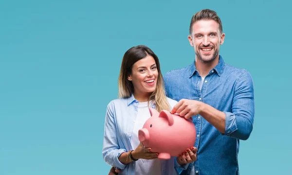 Jovem Casal Apaixonado Segurando Porquinho Banco Sobre Fundo Isolado Com — Fotografia de Stock