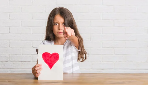 Young Hispanic Kid Sitting Table Giving Mother Day Card Pointing — Stock Photo, Image