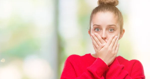 Young Blonde Woman Wearing Bun Red Sweater Shocked Covering Mouth — Stock Photo, Image