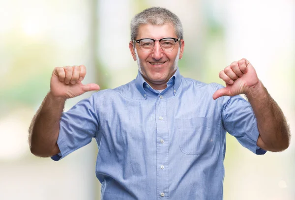 Handsome senior man wearing glasses over isolated background looking confident with smile on face, pointing oneself with fingers proud and happy.