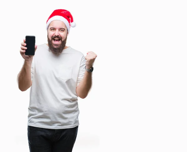感情を応援分離背景誇りに思って叫んでと勝利と非常に興奮して 成功を祝っての上クリスマス帽子 表示中のスマート フォンの画面を着て若い白人男 — ストック写真