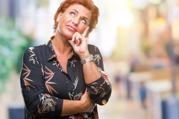 Atrractive Senior Caucasian Redhead Woman Isolated Background Hand Chin Thinking — стоковое фото