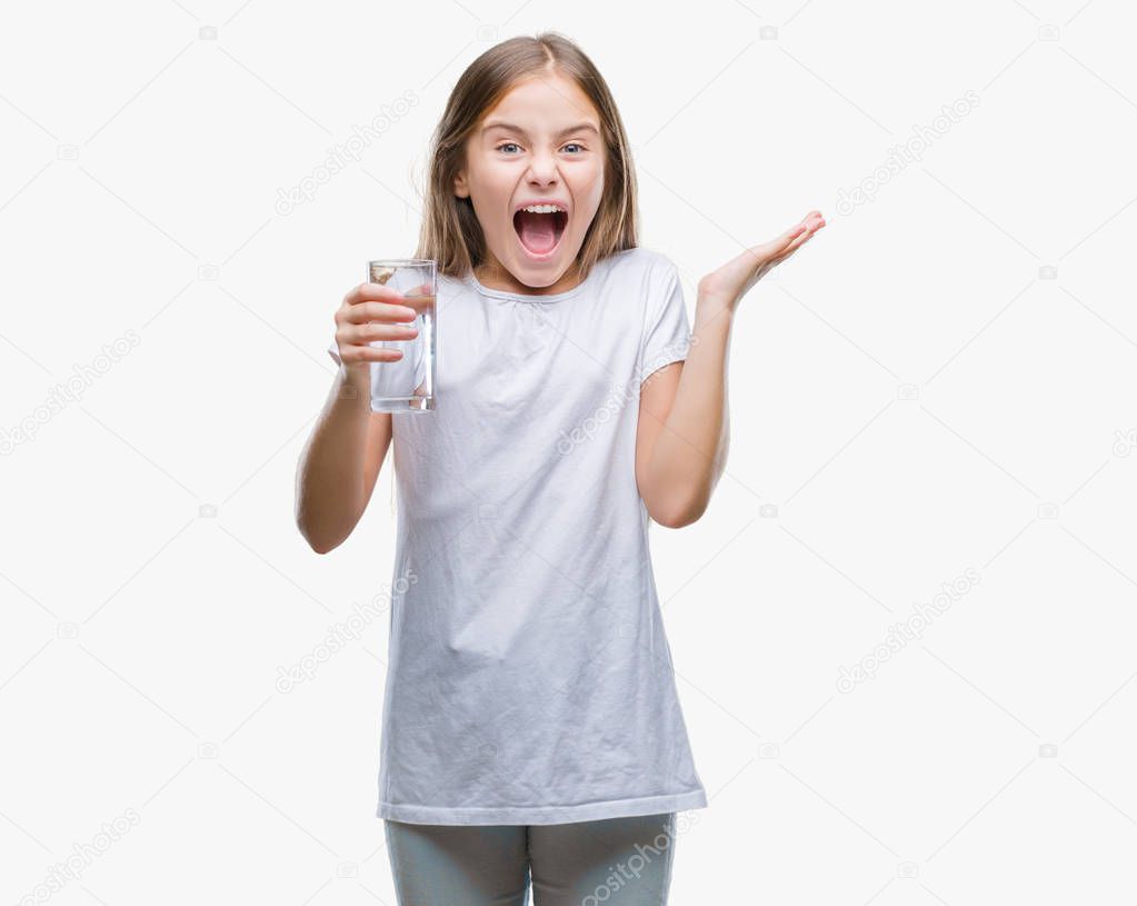 Young beautiful girl drinking glass of water over isolated background very happy and excited, winner expression celebrating victory screaming with big smile and raised hands