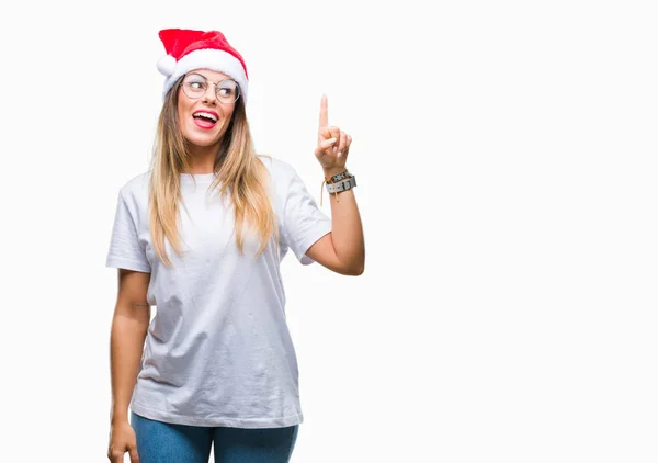 Mujer Hermosa Joven Con Sombrero Navidad Sobre Fondo Aislado Señalando — Foto de Stock