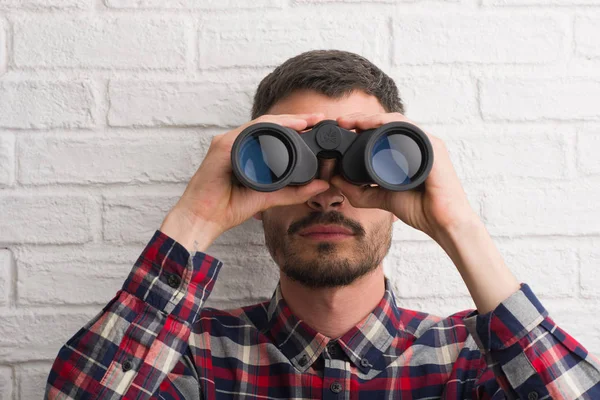 Young Adult Man Brick Wall Looking Binoculars Confident Expression Smart — Stock Photo, Image