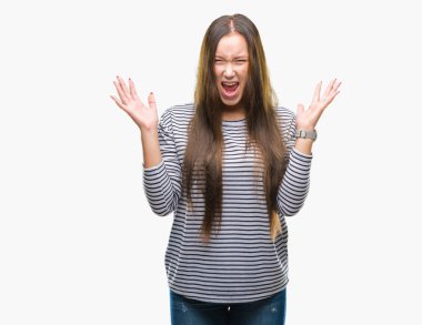 Genç güzel beyaz kadın deli ve silah ile başarı için deli kutluyor izole arka plan üzerinde kaldırdı ve heyecanlı çığlık gözler kapalı. Kazanan kavramı