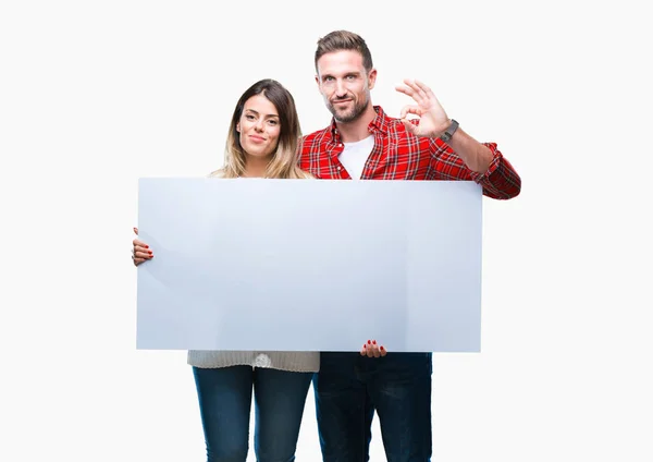 Young Couple Together Holding Blank Banner Isolated Background Doing Sign — Stock Photo, Image