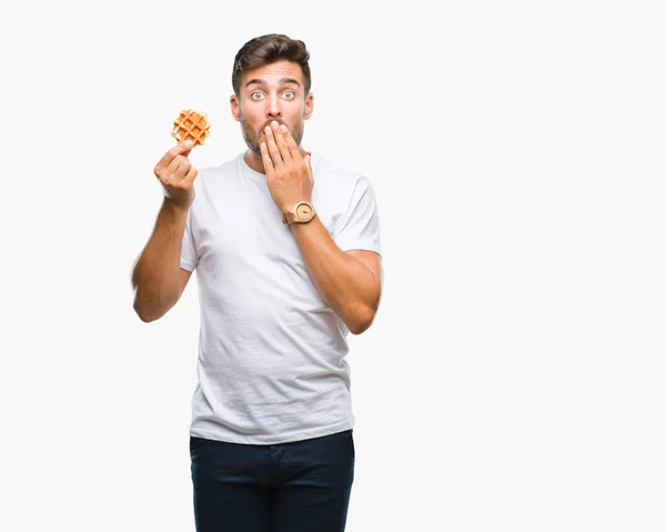 Young Handsome Man Eating Sweet Waffle Isolated Background Cover Mouth — Stock Photo, Image
