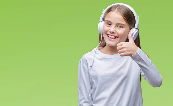 Junges Schönes Mädchen Mit Kopfhörern Das Musik Über Isoliertem Hintergrund — Stockfoto